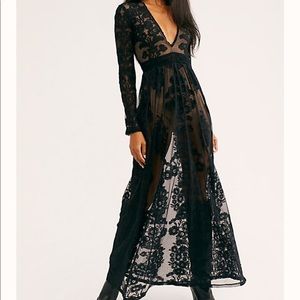 Black-sheer long lace dress with nude body suit.